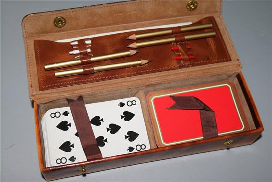 An Asprey leather cased travelling cribbage set and a gilt mounted wooden clock impressed Asprey en verso. 8in.